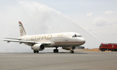 Etihad Airways flight aborts take-off from Melbourne after tires burst