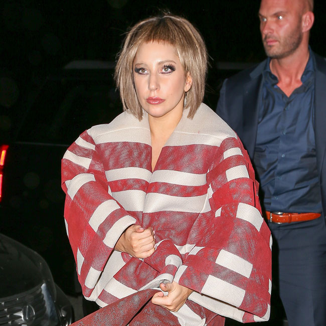 Lady Gaga spotted with a new look as she greets her fans while arriving at her apartment in New York City
