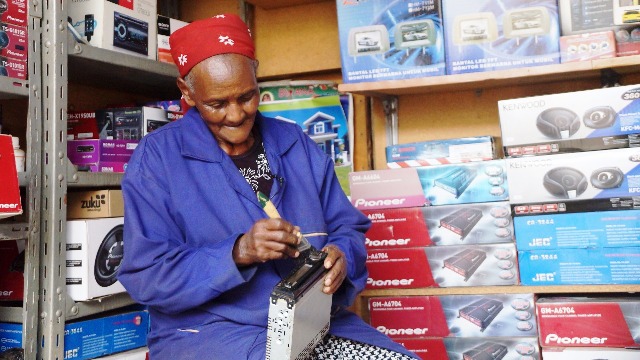 78-year-old works alongside her great-grandsons at a Nairobi audio shop