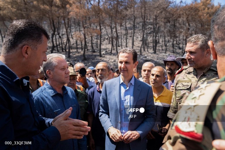 Syria doubles pay for civil servants, military personnel