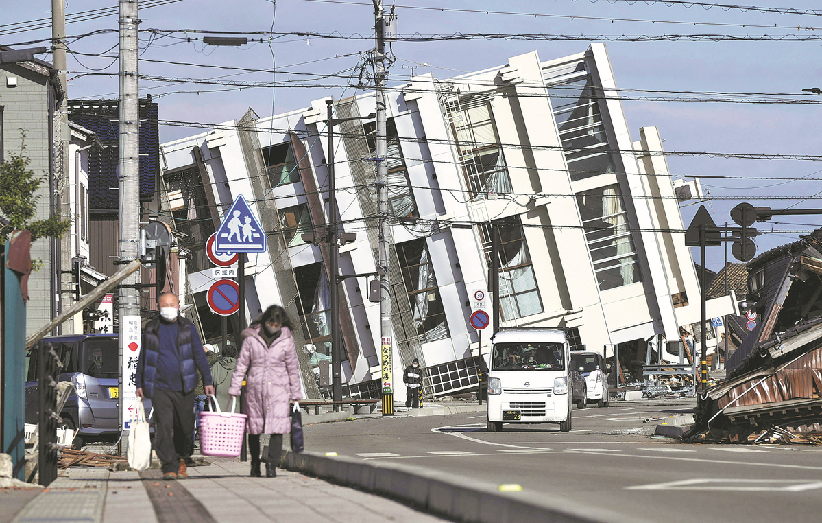 Radioactive water spills over after quakes hit Japan