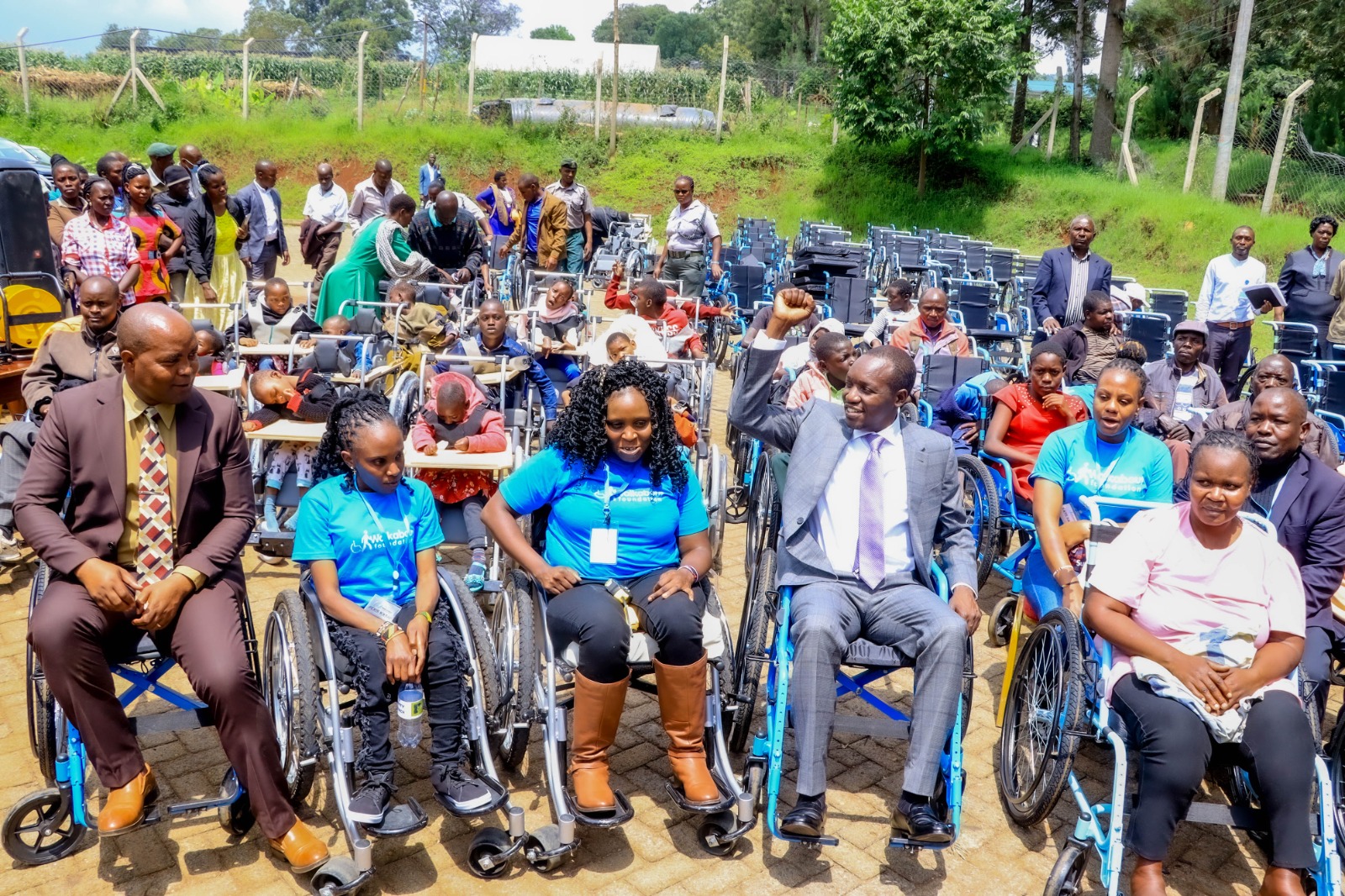 People with mobility challenges benefit from 106 wheelchairs from walkabout foundation in Kisii
