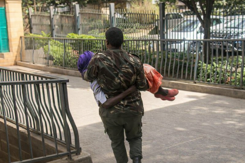 Footage shows police officer carrying 105-year-old woman to Nairobi courtroom amid missing file puzzle