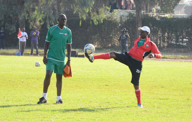 Harambee Stars coach Stanley Okumbi on the ball alongside his assistant Musa Otieno during Stars training at Utali Grounds on Saturday, 19th, March, 2016.PHOTO/Timothy Olobulu