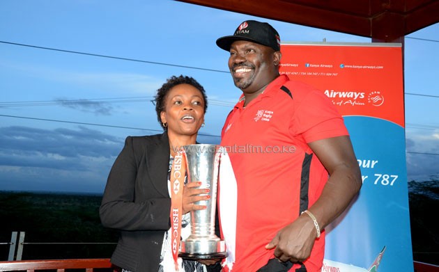 Kenya 7s head coach Benjamin Ayimba with his wife when the team returned from the famous Singapore Sevens triumph.PHOTO/Timothy Olobulu