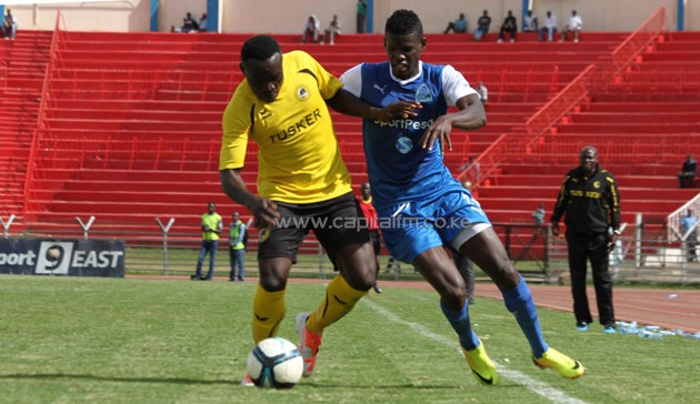 Gor Mahia's Abouba Sibomana vies for the ball with Tusker FC's Coliins Shivachi/ PHOTO: Timothy Olobulu