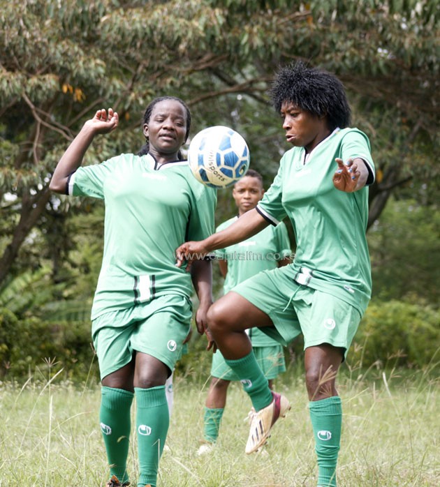 Harambee Starlets' Tabaka Chacha vies for the ball against captain Anne Aluoch.PHOTO/Raymond Makhaya