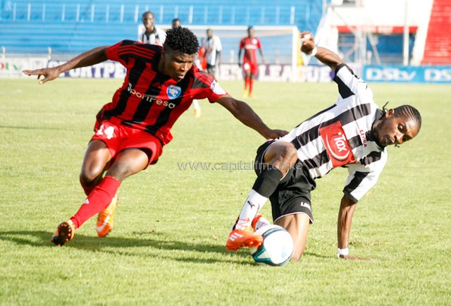 Ushuru's Rosevelt Blaty goes down under a challenge from AFC Leopards' Simon Abuko. PHOTO/ Raymond Makhaya