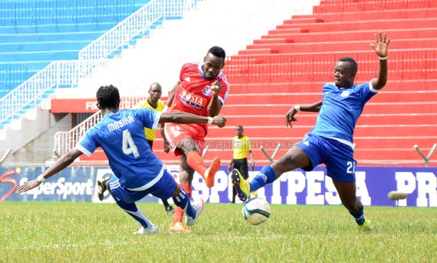 City Stars duo of Luis Masika (left) and John Amboko (right) attempts to block a shot from Posta Ranger's Collins Neto.PHOTO/Timothy Olobulu.