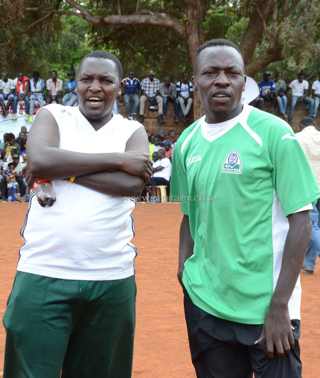 Gor Mahia Youth FC assistant coach Zablon 'Pro' Otieno (right) with a fan during the 2015 Koth Biro tournament.PHOTO/Timothy Olobulu