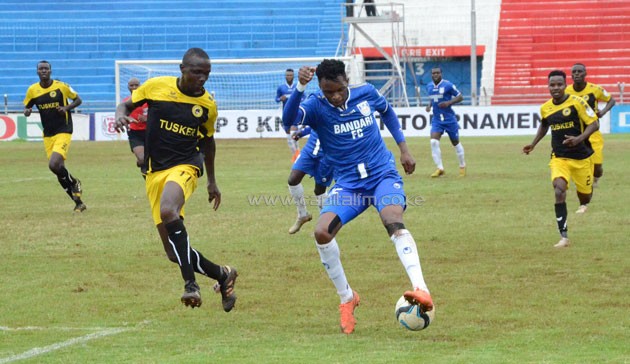 Bandari's Edwin Lavatsa (right) in action against Tusker FC's Llyode Wahome.PHOTO/Timothy Olobulu.