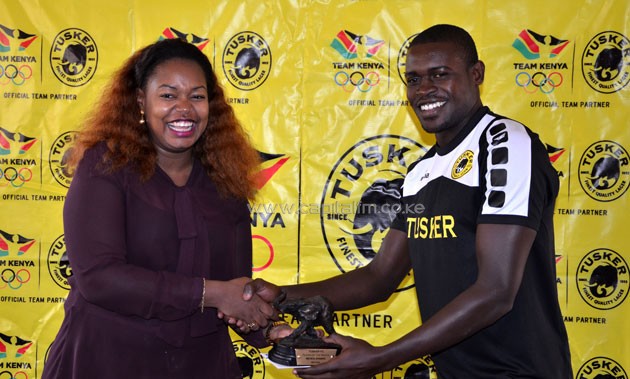 Michael Khamati receiving the Tusker FC's Player of the Month for May.