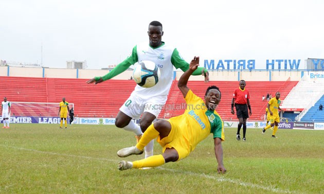 Mathare United midfielder Edward Seda goes down from Gor Mahia's Khalid Aucho challenge. PHOTO/Timothy Olobulu