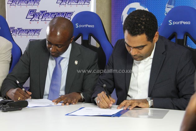 SportPesa CEO Ronald Karauri and Extrem Sports CEO Mohammed Husseinsigning an agreement.PHOTO/Timothy Olobulu