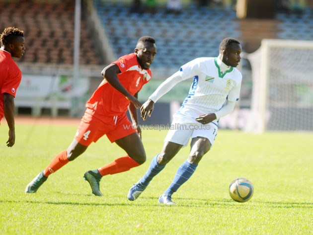 Taifa Stars' Elias Mrigao in action against Kenya's Eugine Asike.