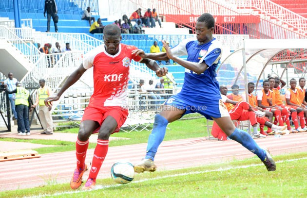 Ulinzi Stars midfielder Vincent Ochieng vies for the ball with Homeboyz skipper Faraj Ominde.PHOTO/Timothy Olobulu