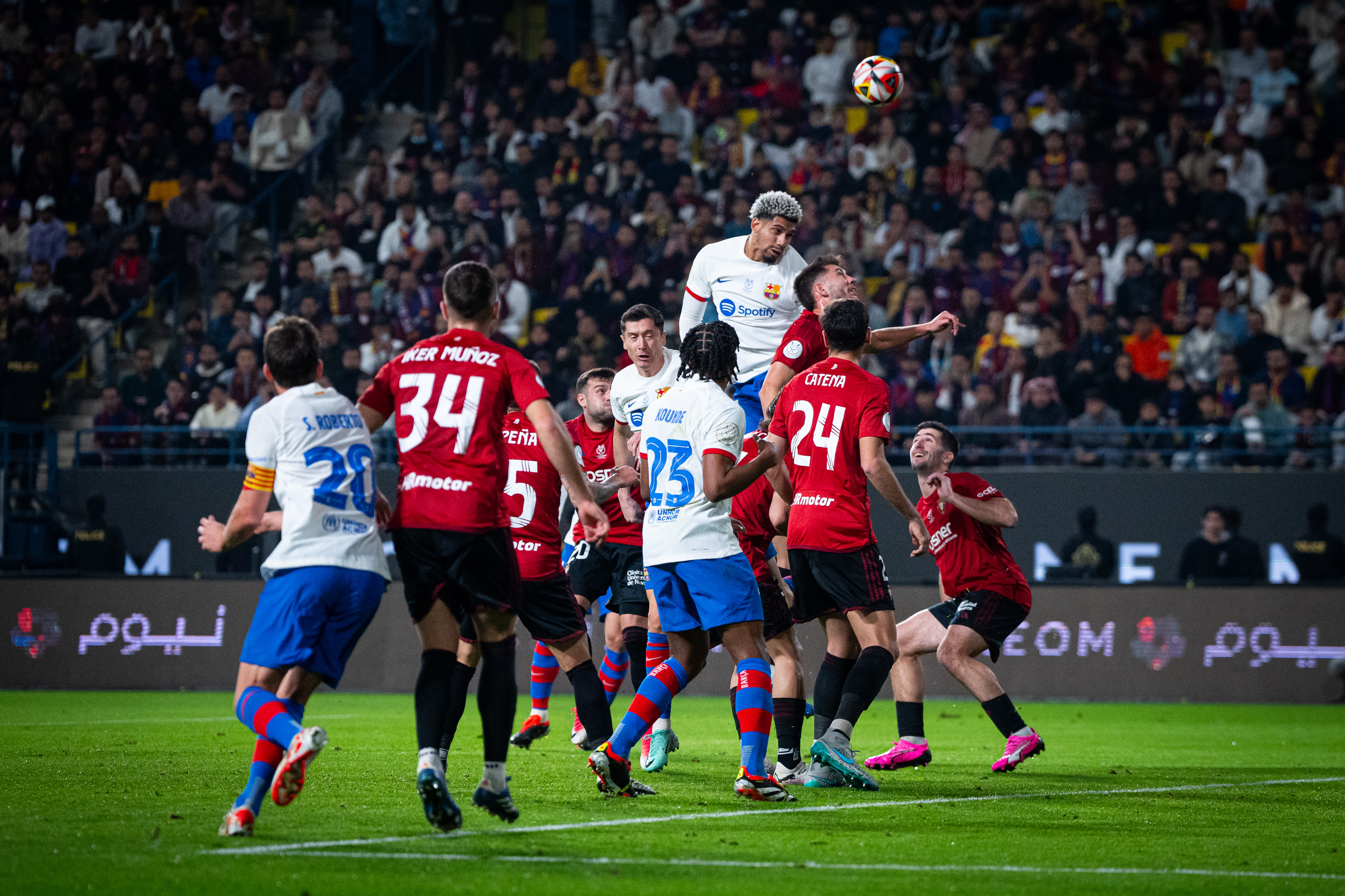 Barca beat Osasuna to set up Madrid Super Cup clash