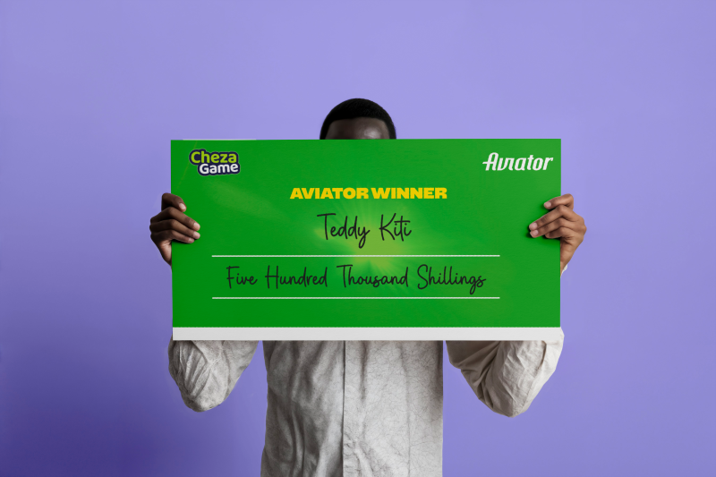 Aviator winner hides face as he receives Sh500,000 Cheque from Chezagame
